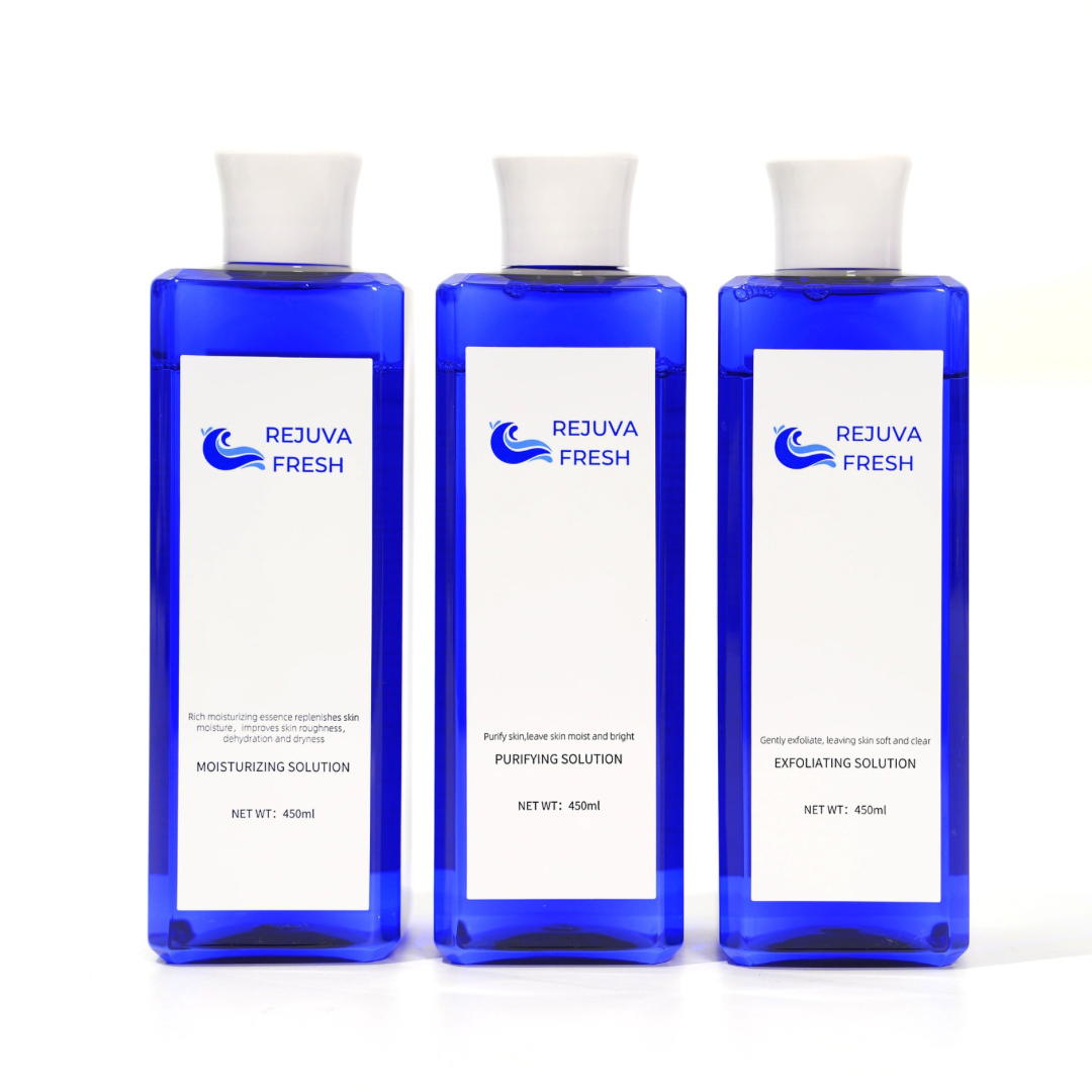 Three blue bottles of Rejuva Fresh Hydro Dermabrasion Solution, each labeled as Purifying, Moisturizing, and Exfoliating, set against a white background.